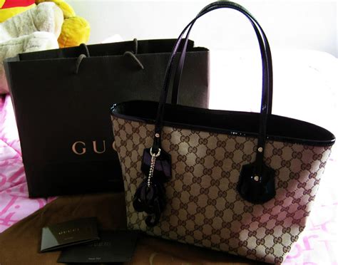 gucci jolie medium tote with detachable charms|Gucci tote bag.